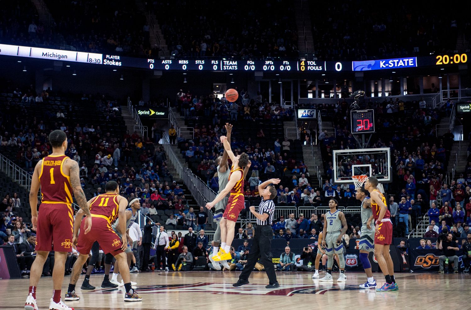 Mar 15, 2019; Kansas City, MO, USA; Kansas State Wildcats forward Makol Mawien (14) and Iowa State Cyclones forward Michael Jacobson (12) tip-off during the first half of the semifinals of the Big 12 conference tournament at Sprint Center. Mandatory Credit: Amy Kontras-USA TODAY Sports